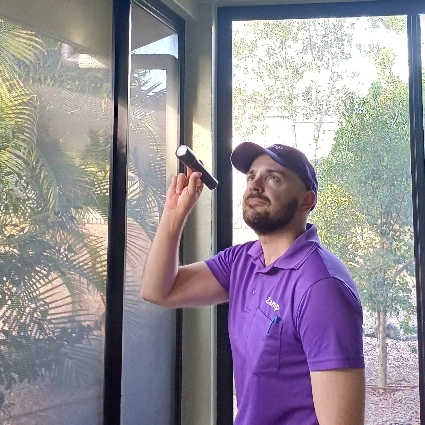 Dale with torch inspecting for pests