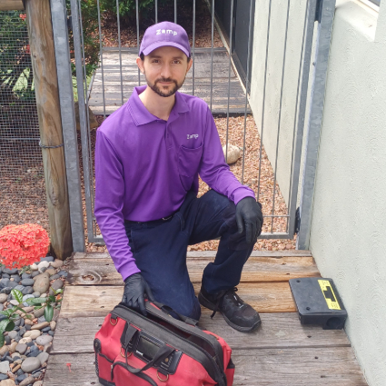 Rob installing a secure rodent station.